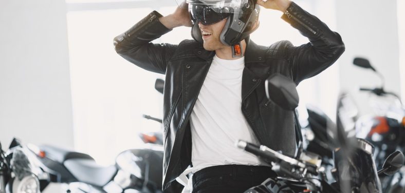 Handsome man choosing a motorcycle to buy